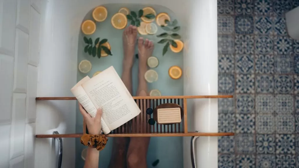 Person Holding Book Page on a wood Table